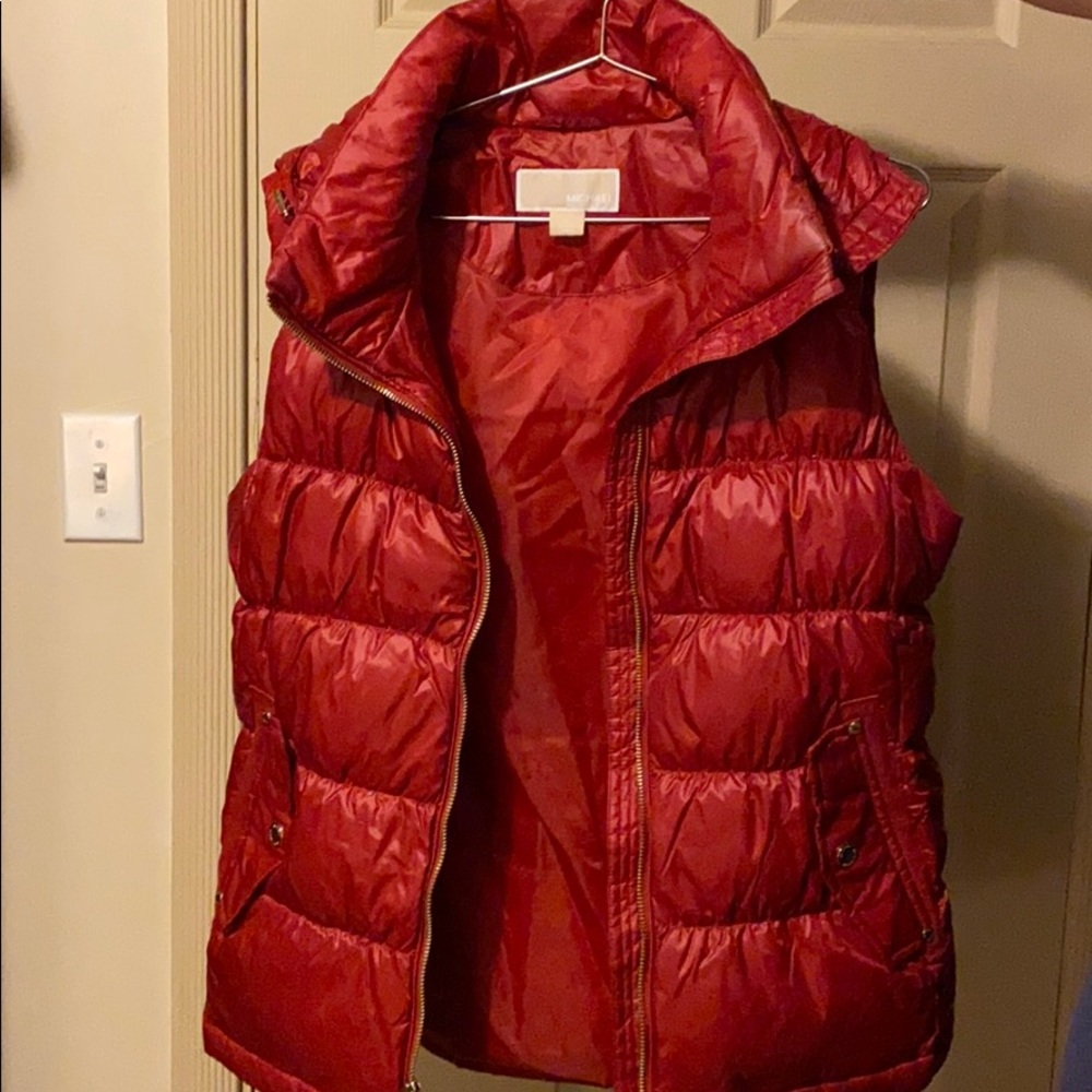 Michael Kors women warm vest with a hood.